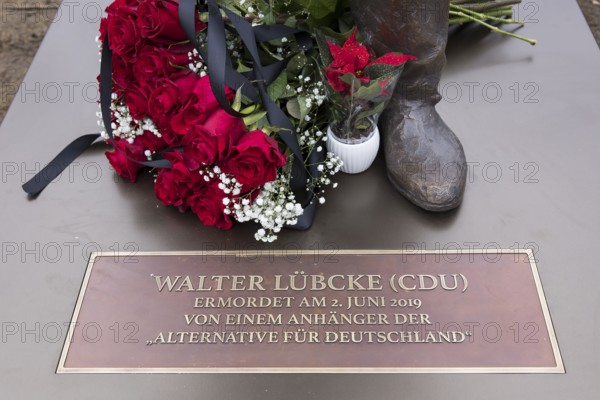 Red roses with a mourning ribbon lie on the Walter LÃ¼bcke memorial during the erection of Walter LÃ¼bcke Platz in front of the Konrad Adenauer Haus, the party headquarters of the Christian Democratic Union (CDU) on 2 December 2025. The square was erected by the Centre for Political Beauty (ZPS) and approved by the Berlin Mitte district authority for two years. Walter LÃ¼bcke was a member of the Hessian state parliament for the CDU and was murdered by an AfD supporter on 2 June 2019