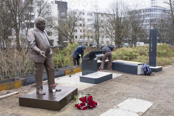 Workers erect the Walter LÃ¼bcke Square in front of the Konrad Adenauer Haus, the party headquarters of the Christian Democratic Union (CDU) on 2 December 2025. The square was erected by the Centre for Political Beauty (ZPS) and approved by the Berlin Mitte district authority for two years. Walter LÃ¼bcke was a member of the Hessian state parliament for the CDU and was murdered by an AfD supporter on 2 June 2019