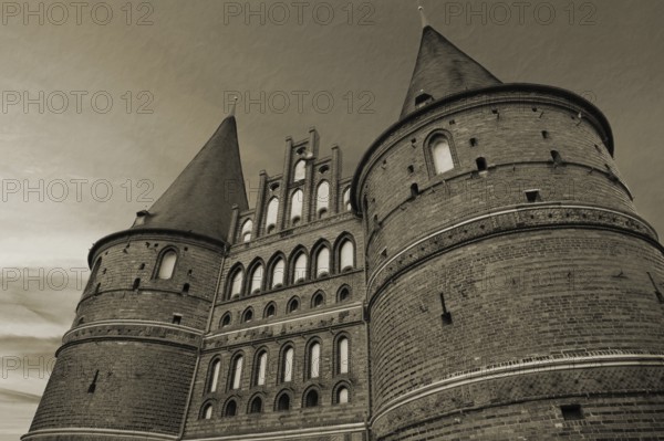 Holstentor, historic city gate from 1478, evening sky, cuttlefish, Holstentorplatz, Hanseatic City of LÃ¼beck, Schleswig-Holstein, Germany