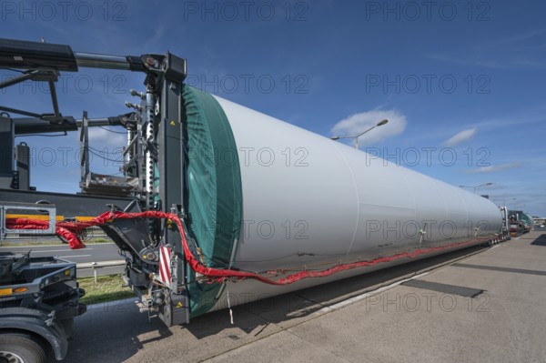 Overlong heavy-duty transporter with a part of a wind turbine, at a motorway rest area of the A9, Mecklenburg-Western Pomerania, Germany