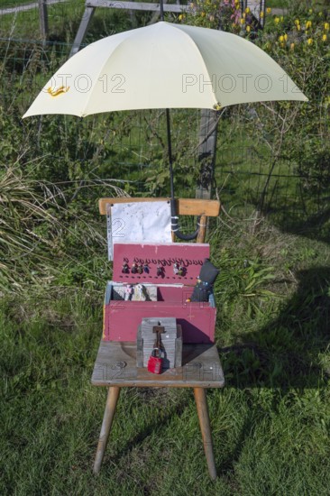 Jewellery offering under an umbrella by the wayside, Ahrenshoop, DarÃŸ, Mecklenburg-Western Pomerania, Germany