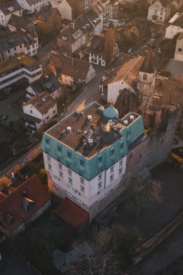 Old building with copper roof in a small village surrounded by autumn trees, Dillweisenstein, Pforzheim, Germany