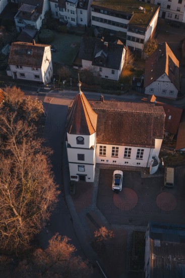 Small church from above, surrounded by village and autumn vegetation, Dillweisenstein, Pforzheim, Germany