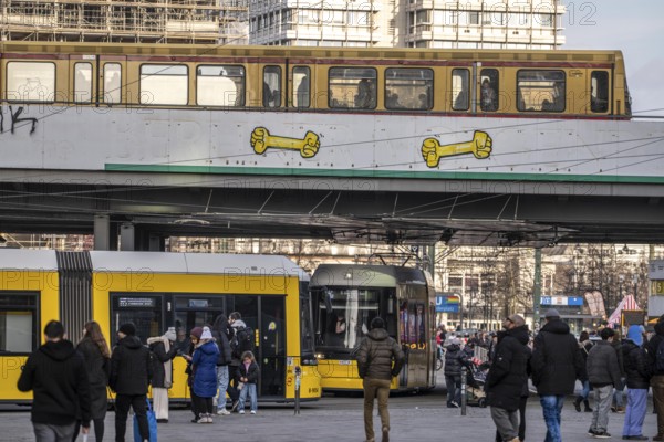 Tram, S-Bahn at Alexanderplatz in Berlin, passers-by, Germany