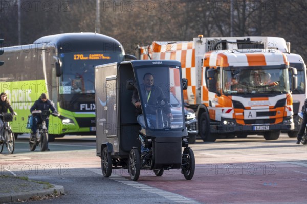 E-cargo bike, e-cargo bike delivery vehicle, pedal drives with e-motor assistance, from the mail-order company Amazon, from a micromobility center near Alexanderplatz, the electric mini transporters in the inner city area deliver over 1.5 million parcels annually, the manufacturer of the e-cargo bikes is the German company Mubea, from Sauerland, Germany