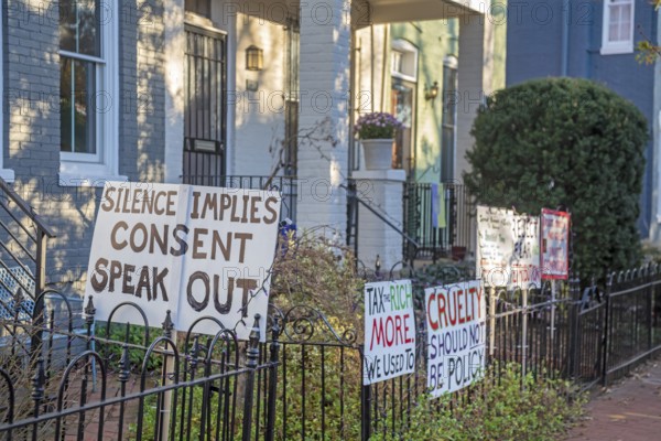 Washington, DC - Signs outside a home on Capitol Hill opposing Trump Administration policies