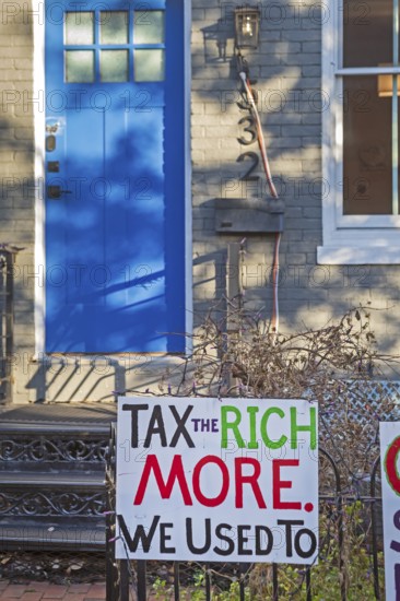 Washington, DC - Signs outside a home on Capitol Hill opposing Trump Administration policies