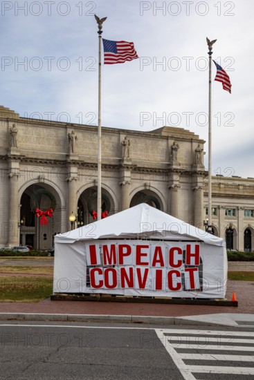 Washington, DC - A large sign outside Union Station calls for impeachment and conviction
