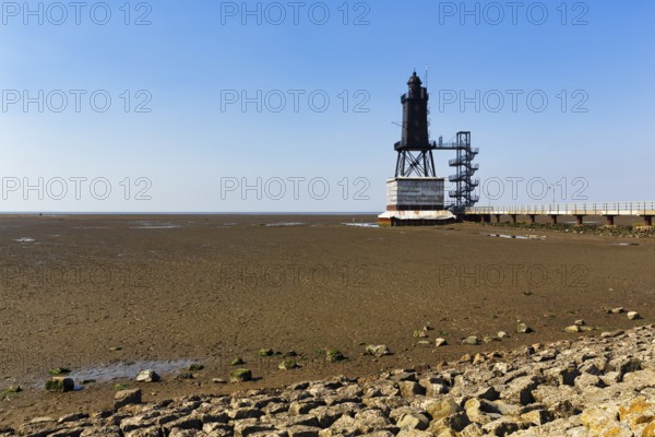 Historic lighthouse Obereversand im Wadden Sea, iron tower with black lantern, landmark, Dorum-Neufeld, Wurster North Sea coast near Cuxhaven, Lower Saxony, Germany