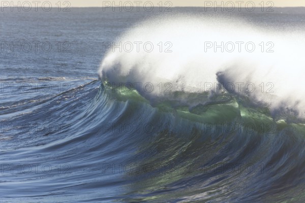 Perfectly constructed wave with turquoise colored sea water. Byron Bay, New South Wales, Australia