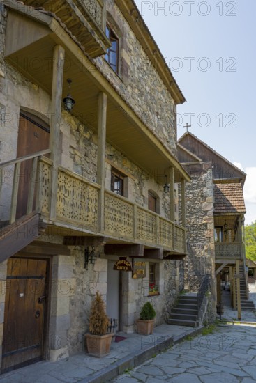 Ancient building with wooden ornaments and outdoor stone steps, Old Town, Sharambeyan Street, Dilijan, Delijan, Delijan, Tavush Province, Armenia