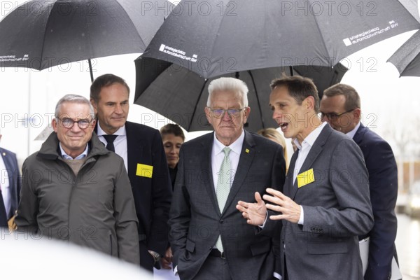 Annual event on the BW Automotive Industry Strategy Dialogue (SDA) in Stuttgart. From left, Thomas Strobl (CDU, Minister of the Interior), Oliver Blume (CEO Porsche AG and Volkswagen AG), Winfried Kretschmann, (Greens, Minister-President BW), Gerd Walker (AUDI AG, Chief Logistics Officer) . Automotive industry conference. Stuttgart, Baden-WÃ¼rttemberg, Germany