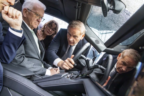 Annual event on the BW Automotive Industry Strategy Dialogue (SDA) in Stuttgart. Winfried Kretschmann, (Greens, Minister-President BW) and Stéphane Séjourné (Executive Vice President of the European Commission and Commissioner for Prosperity and Industrial Strategy) in a Porsche Cayenne. Porsche boss Oliver Blume. Automotive industry conference. Stuttgart, Baden-WÃ¼rttemberg, Germany