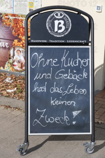 Blackboard with slogan in front of a café, Without cake and pastry, life has no purpose, Ahrenshoop, DarÃŸ, Mecklenburg-Western Pomerania, Germany