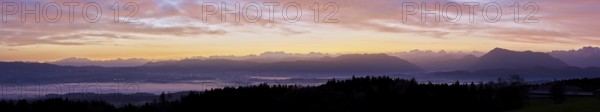 Panorama from Horben with a view of the foggy Reuss Valley, in the background the Alpstein, the Glarner Alps and the Rigi, in the light of dawn, Beinwil-Freiamt, Canton of Aargau, Switzerland