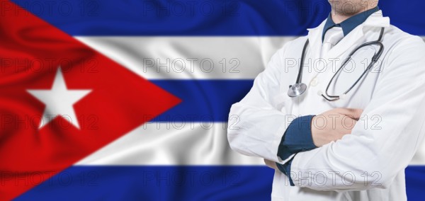 Cuba healthcare concept. Male doctor on Cuban flag. Doctor with crossed arms on Cuba flag