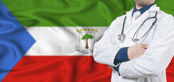 Equatorial Guinea healthcare concept. Male doctor on Equatorial Guinea flag. Doctor with crossed arms on Equatorial Guinea flag