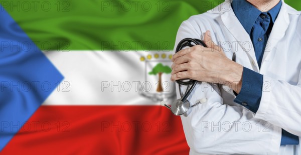 Equatorial Guinea healthcare concept. Doctor with stethoscope on Equatorial Guinea flag. Doctor holding stethoscope on Equatorial Guinean flag