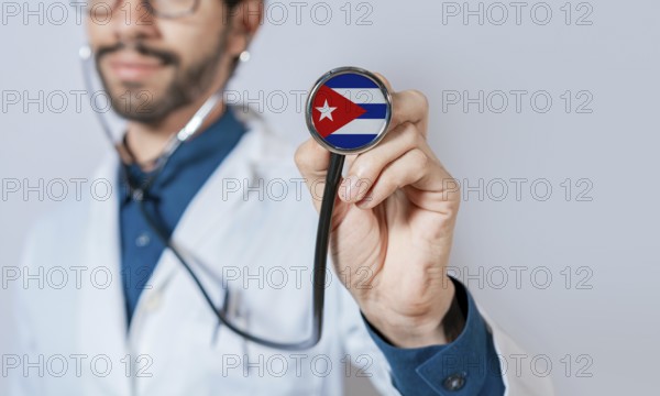 Doctor holding stethoscope with Cuba flag. Cuba health and care concept. Cuba flag on stethoscope