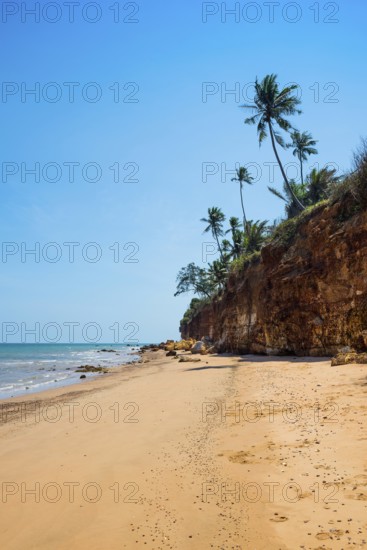 Lonely beach with red rocks and coconut trees, Red Cliffs, Bang Saphan Noi, Prachuap Khiri Khan Province, Central Thailand, Thailand