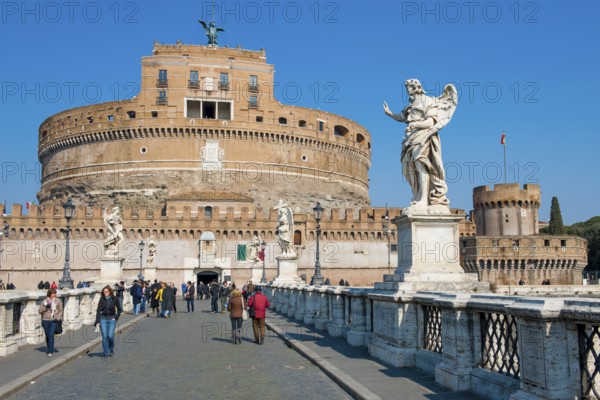 View of Castel Sant'Angelo Sant' Angelo built as an ancient mausoleum Hadrian burial site for Emperor Caesar Emperor Hadrian on the banks of the Tiber, in front of it Ponte degli Angeli Angel Bridge with statues of winged beings angels, Rome, Lazio, Italy
