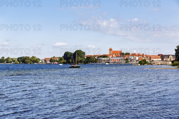 Shore of Lake MÃ¼ritz, city harbor with St. George Church, sailboat, Waren an der MÃ¼ritz, Mecklenburg-Western Pomerania, Germany