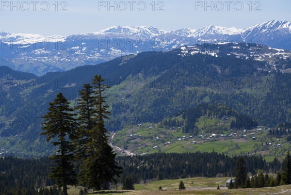 Snow-capped mountains with green valleys and scattered villages, view from Goderdzi Pass, Ajara region, Adjara, autonomous republic, Georgia