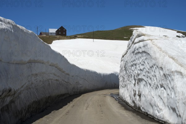 A narrow path through high snow walls in a wintry mountain landscape, Goderdzi Pass, Ajara region, Adjara, autonomous republic, Georgia