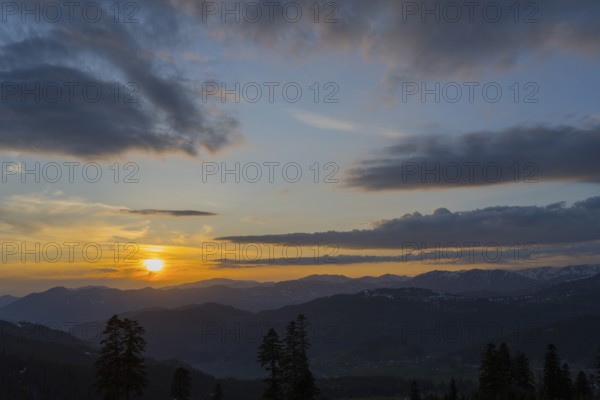 A romantic sunset over mountains with colorful sky and clouds, view from Goderdzi Pass, Ajara region, Adjara, autonomous republic, Georgia