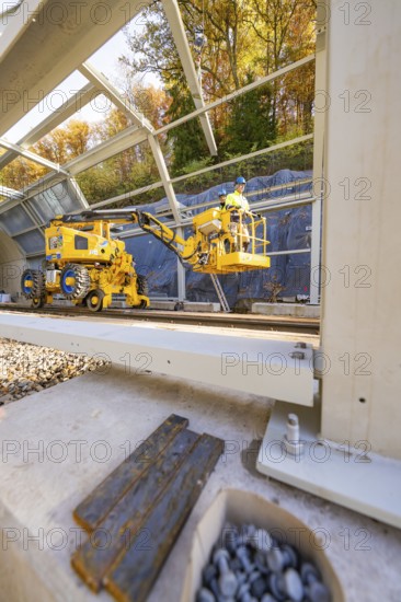 Interior view of a construction site with yellow machines and a metal frame, Hermann Hesse Railway bat tunnel construction site, Calw, Black Forest, Germany