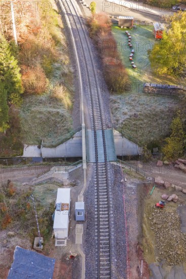 Aerial view of tracks at a railroad crossing with surrounding vegetation, Hermann Hesse Railway bat tunnel construction site, Calw, Black Forest, Germany