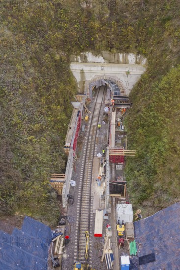 Aerial view of a railway tunnel construction site surrounded by green vegetation, Hermann Hesse Railway bat tunnel construction site, Calw, Black Forest, Germany