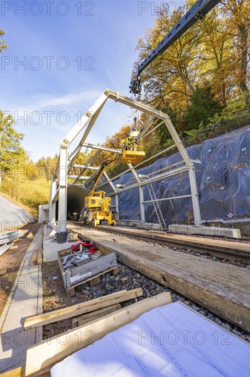 Construction plans and materials on a construction site where workers build metal structures, Hermann Hesse Railway bat tunnel construction site, Calw, Black Forest, Germany