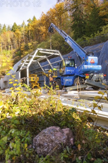 Tunnel construction site with hoists in an autumn landscape, Hermann Hesse Railway bat tunnel construction site, Calw, Black Forest, Germany
