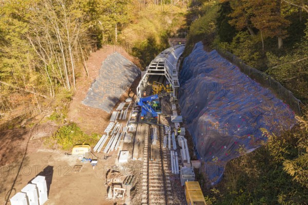 Wide-angle view of a construction site with the construction of metal tunnels along a railroad, Hermann Hesse Railway bat tunnel construction site, Calw, Black Forest, Germany
