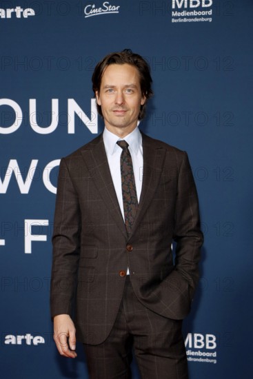 Tom Schilling at the festival opening and the premiere of the movie 'Sentimental Value' at the 20th World Cinema Festival Around the World in 14 films at the cinema at KulturBrauerei in Berlin on 28.11.2025