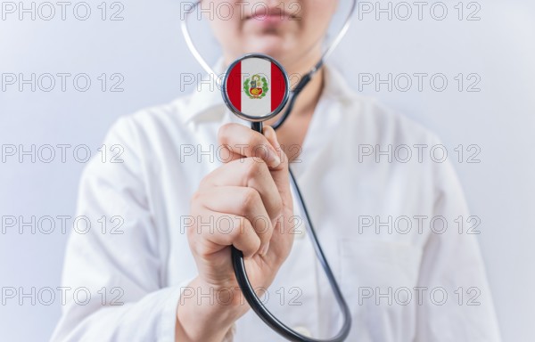 Female doctor holding stethoscope with Peru flag. National health system of Peru