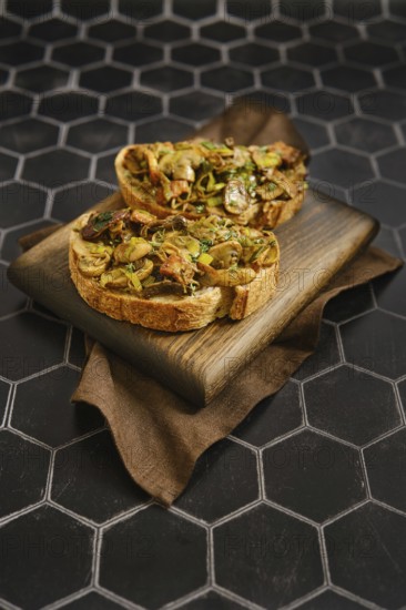 A tasty mushroom sandwiches feature fried honey mushrooms, enoki mushrooms, champignon, and leek. The dish rests on a wooden board, showcasing its rich, earthy flavors and textures, perfect for lunch