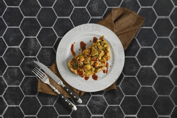 A delicious sandwich features honey mushrooms, enoki mushrooms, champignon, and fresh leek. It is served on a decorative plate with a stylish backdrop, perfect for a light meal or snack