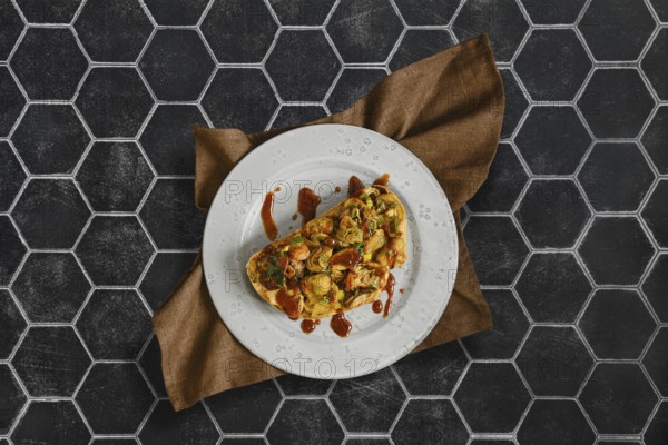 This tasty sandwich combines honey mushroom, enoki mushroom, champignon, and leek on fresh bread. It is carefully arranged on a white plate and set against a stylish hexagonal background