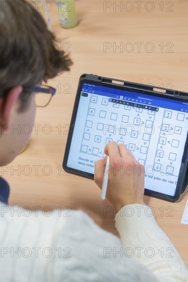 Person taking handwritten notes on a tablet, Jugend Forschungszentrum Nagold, Calw district, Germany