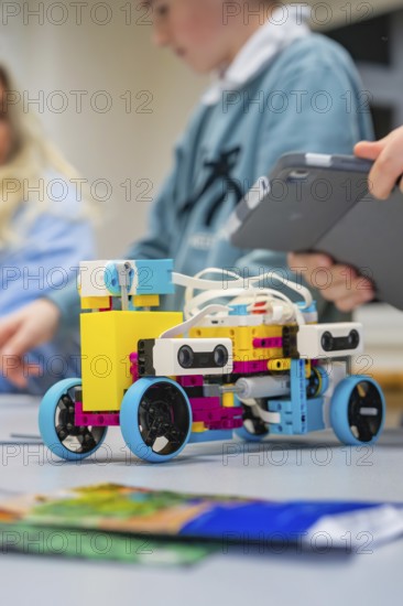 A colorful Lego robot is being assembled by children, Jugend Forschungszentrum Nagold, Calw district, Germany