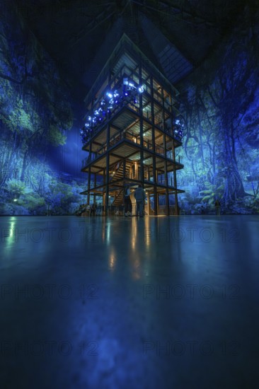 Tall structure with fascinating light installation in a blue room, Amazonia exhibition, Gasometer, Pforzheim, Germany