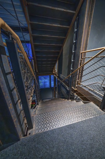 Stairs with industrial design in blue light at night, Amazonia exhibition, Gasometer, Pforzheim, Germany