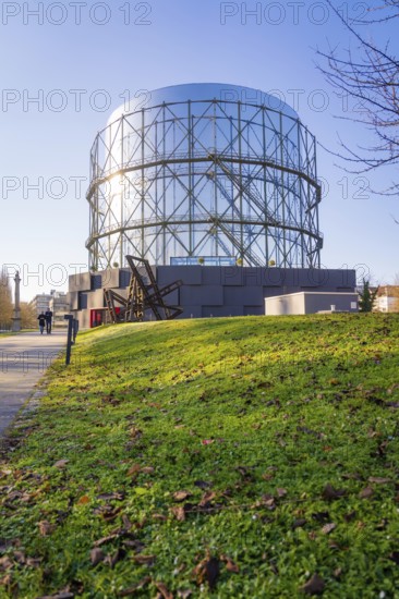 Large steel building in front of a sunny green area, Amazonia exhibition, Gasometer, Pforzheim, Germany