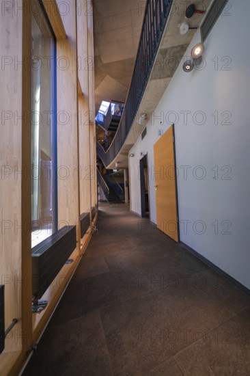 Modern interior with wooden paneling and elegant corridor, Amazonia exhibition, Gasometer, Pforzheim, Germany