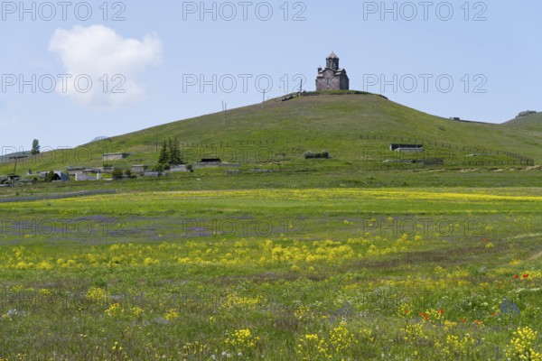 Small church on a hill with blooming meadow in the foreground, Saint Sargis Church, Tsaghkunk, Gegharkunik Province, Armenia