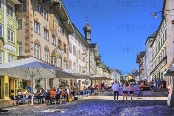 Historic market street with street cafe and typical gabled houses, Bad Tölz. Isartal, Upper Bavaria, Bavaria, Germany