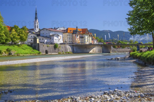 Isar bank with Isar bridge, parish church tower and Marienstift or Krugledererhaus, Bad Tölz. Isartal, Upper Bavaria, Bavaria, Germany
