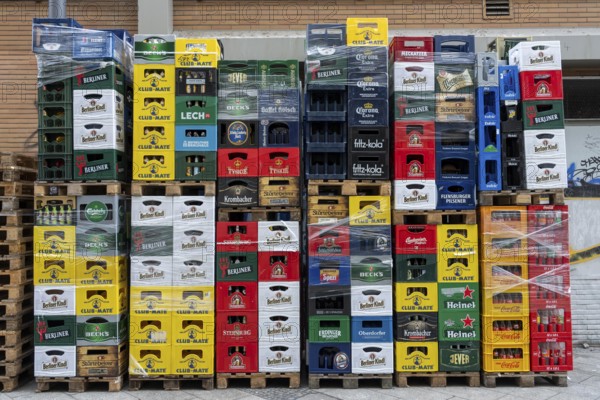 Empty beverage crates, from various manufacturers, bottling, types, stacked at a restaurant, for transport, deposit system, Germany